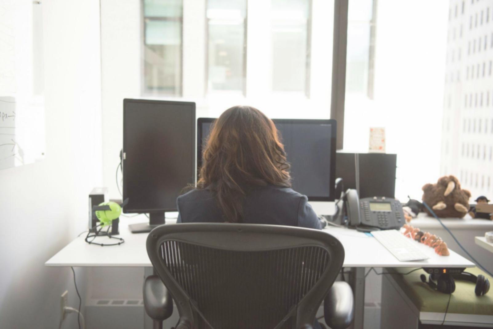 Investment education classroom with financial charts and engaged participants